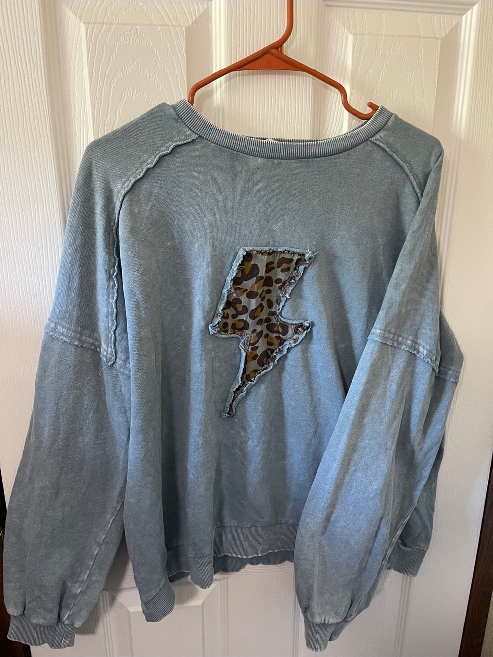 Easel Light Blue Women’s Pullover Sweatshirt with Leopard Lightning Patch